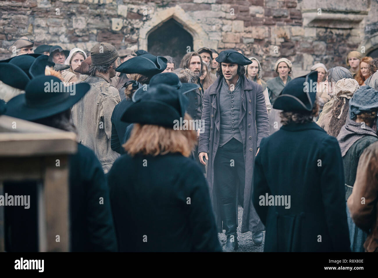 POLDARK, Aidan Turner (center), (Season 4, ep. 401, originally aired in UK on June 10, 2018/aired in US on Sept. 30, 2018). photo: ©PBS/Mammoth Screen/BBC / Courtesy: Everett Collection Stock Photo