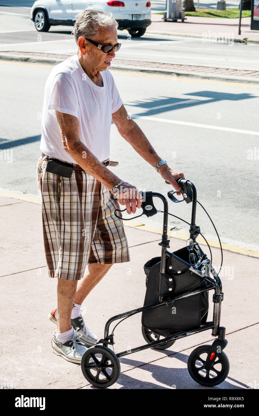 Miami Beach Florida,senior seniors citizen citizens,man men male,Hispanic walker,walking,FL181205002 Stock Photo