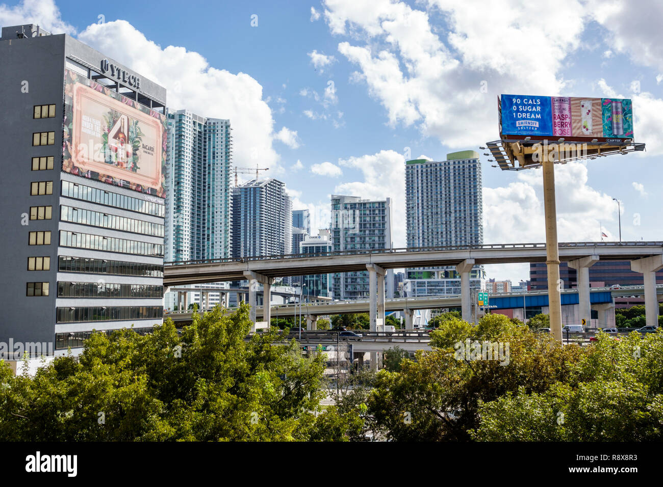 Miami Florida,city skyline billboard advertising raised highways,buildings high rise apartment buildings condominium Stock Photo