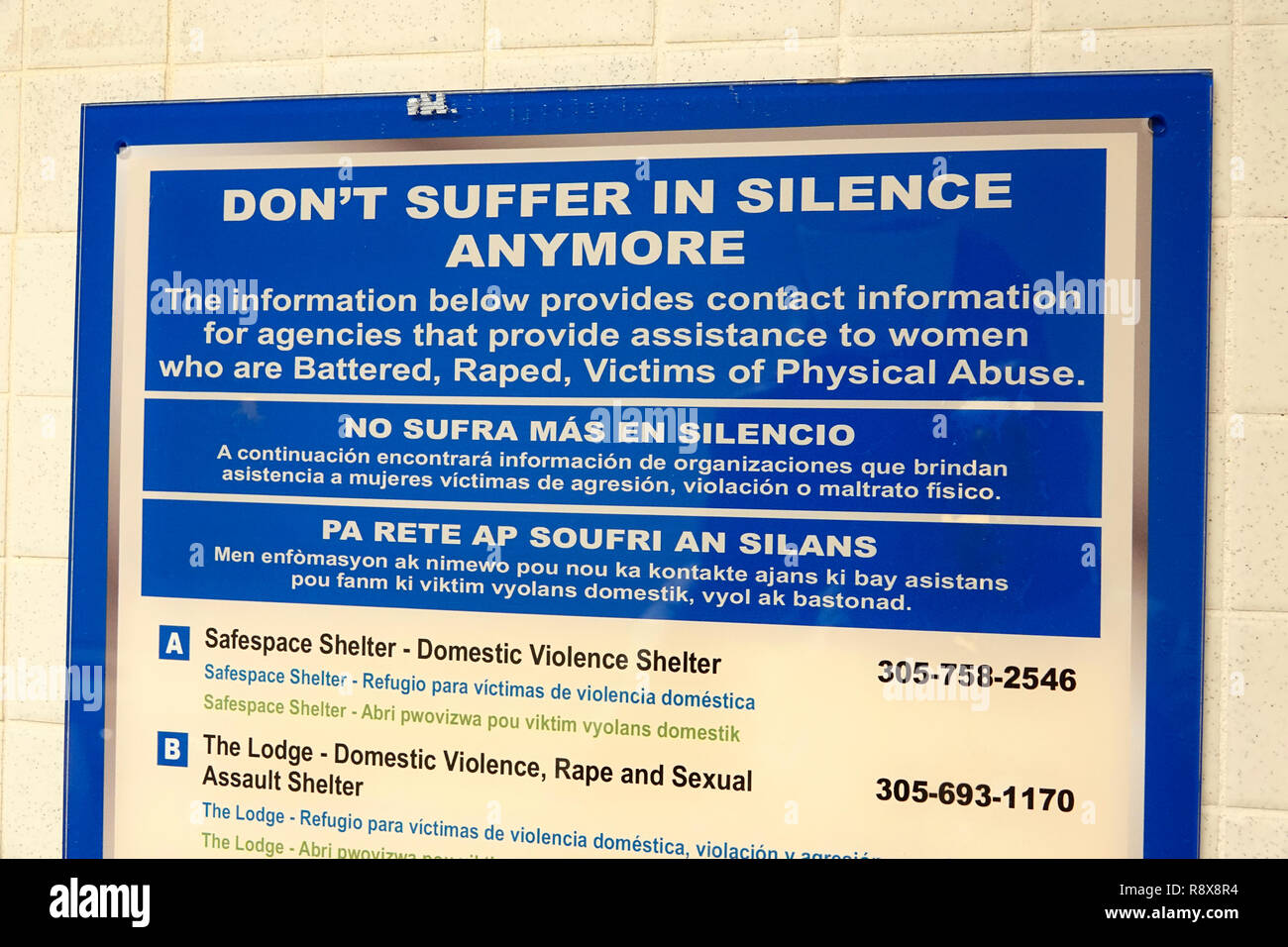 Miami Florida,downtown,message notice sign,battered raped physical abuse victims,English Spanish Creole multiple languages,FL181205060 Stock Photo