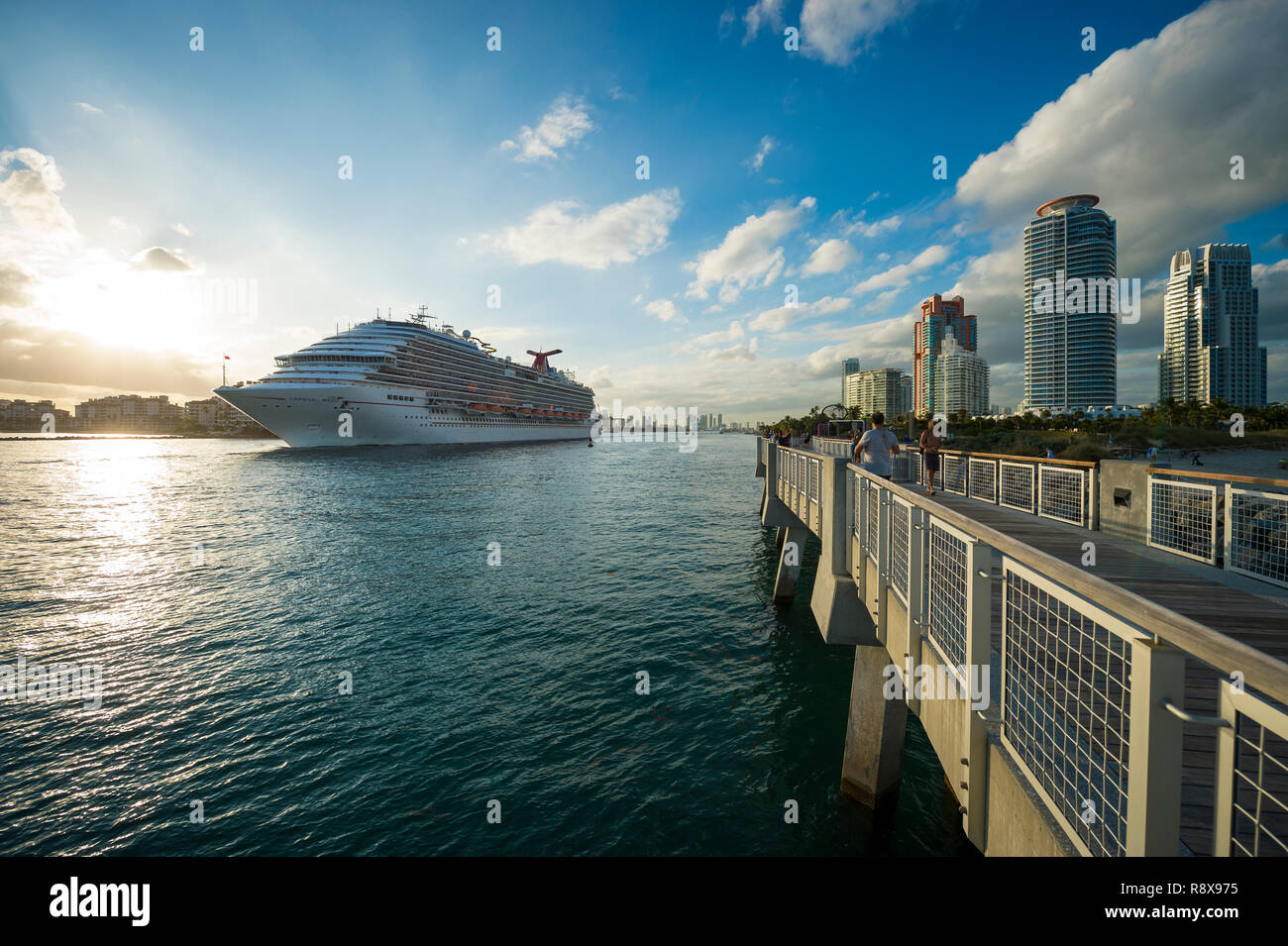 MIAMI - DECEMBER 16, 2018: The Carnival Victory cruise ship departs PortMiami, which set a one-day record of 52,000 passengers at the season's start. Stock Photo