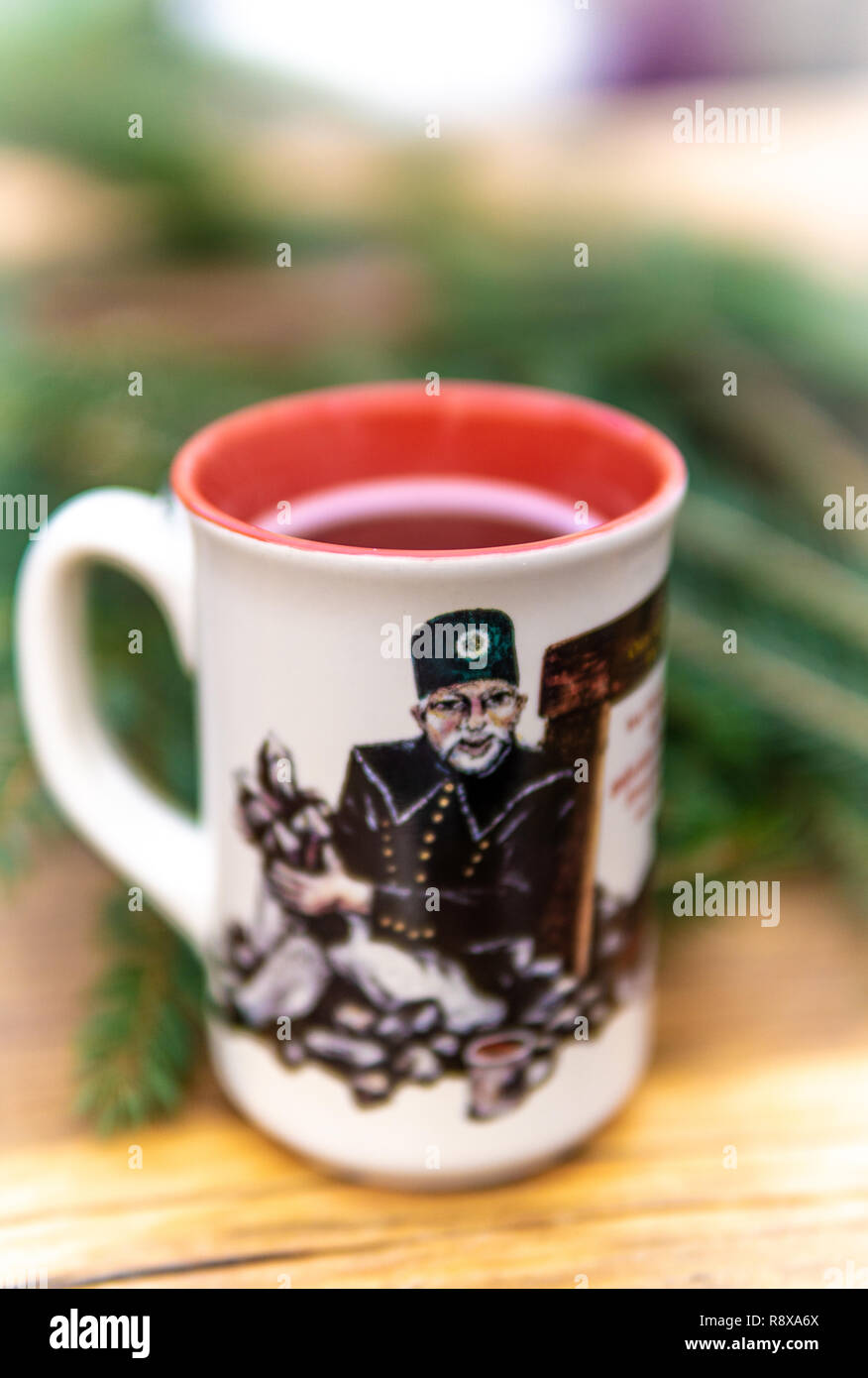 Christmas Hot mulled wine for winter on rustic table with copy space. Stock Photo