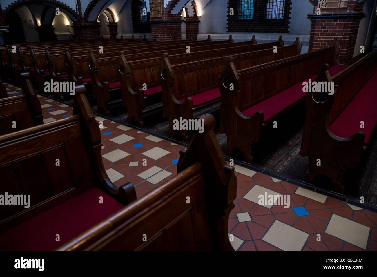 Empty pews in a church in Berlin, Germany. Stock Photo