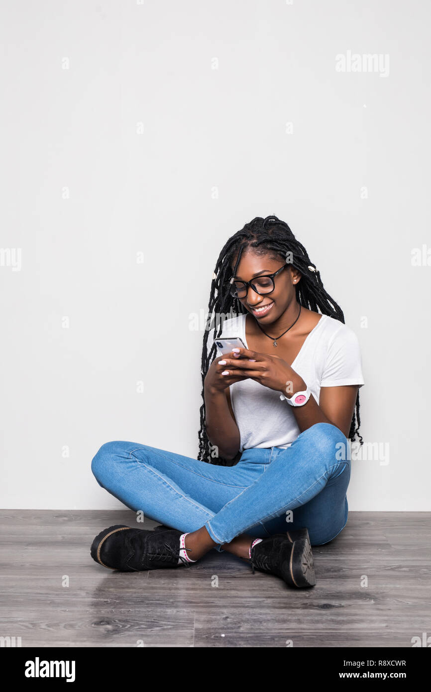 Pretty female sitting on floor with legs up – Jacob Lund Photography Store-  premium stock photo