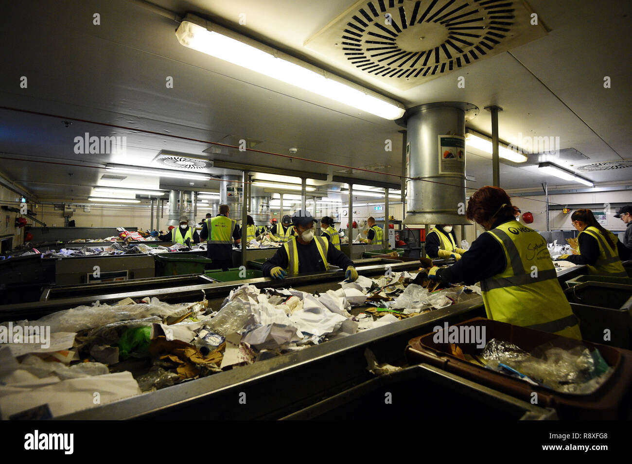 Workers sort recycling at the Veolia Integrated Waste Management