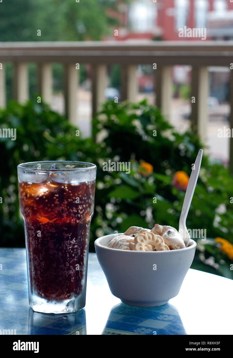 Root beer and ice cream is on a table on the Square Books balcony in