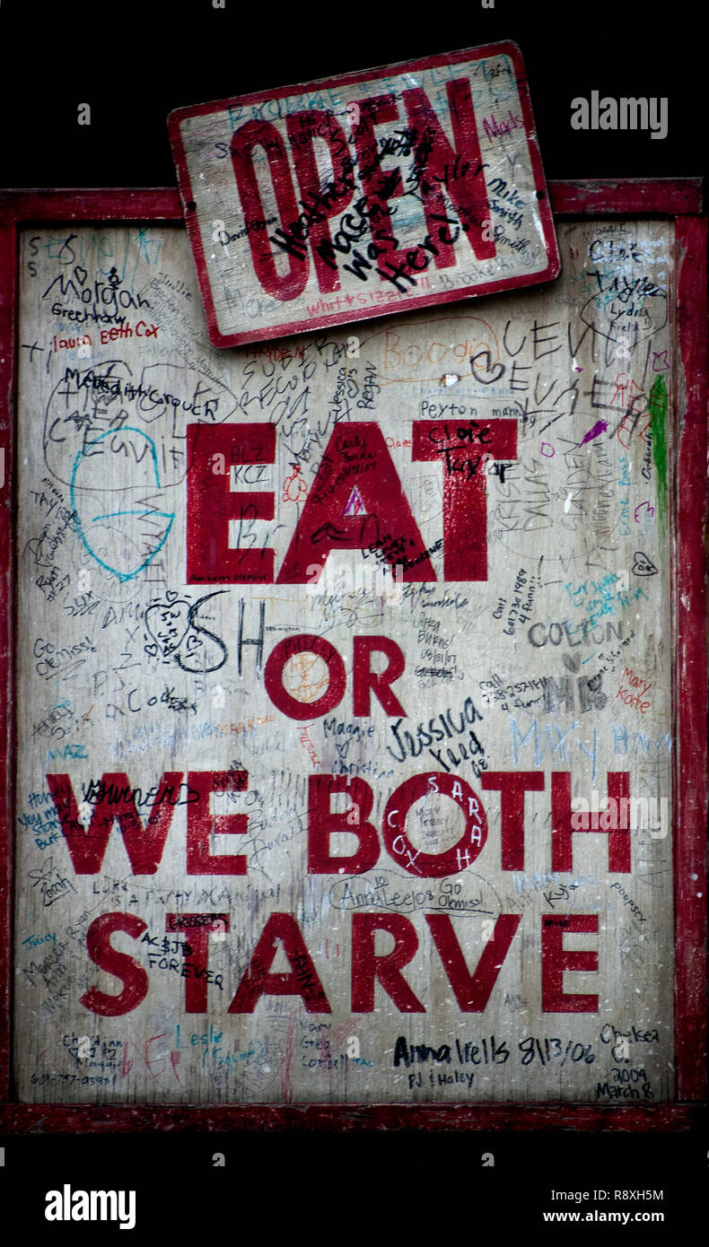 A humorous sign welcomes diners to Taylor Grocery, July 31, 2011, in Taylor, Mississippi. Stock Photo