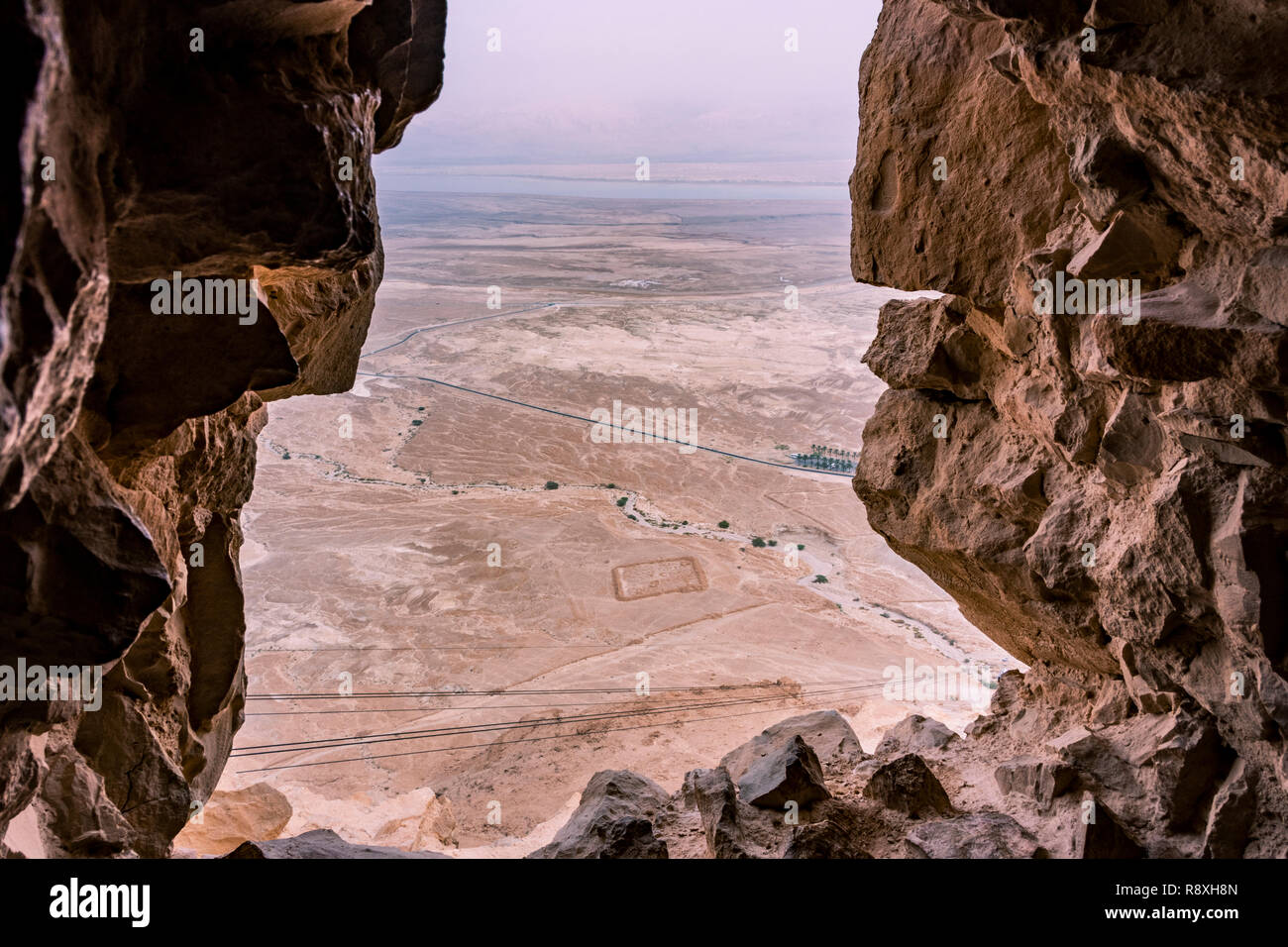 View from the Masada ruins of the Judean desert, the Dead Sea and then Jordanian territory. Marked on the ground one of the Roman siege camps.Israel. Stock Photo