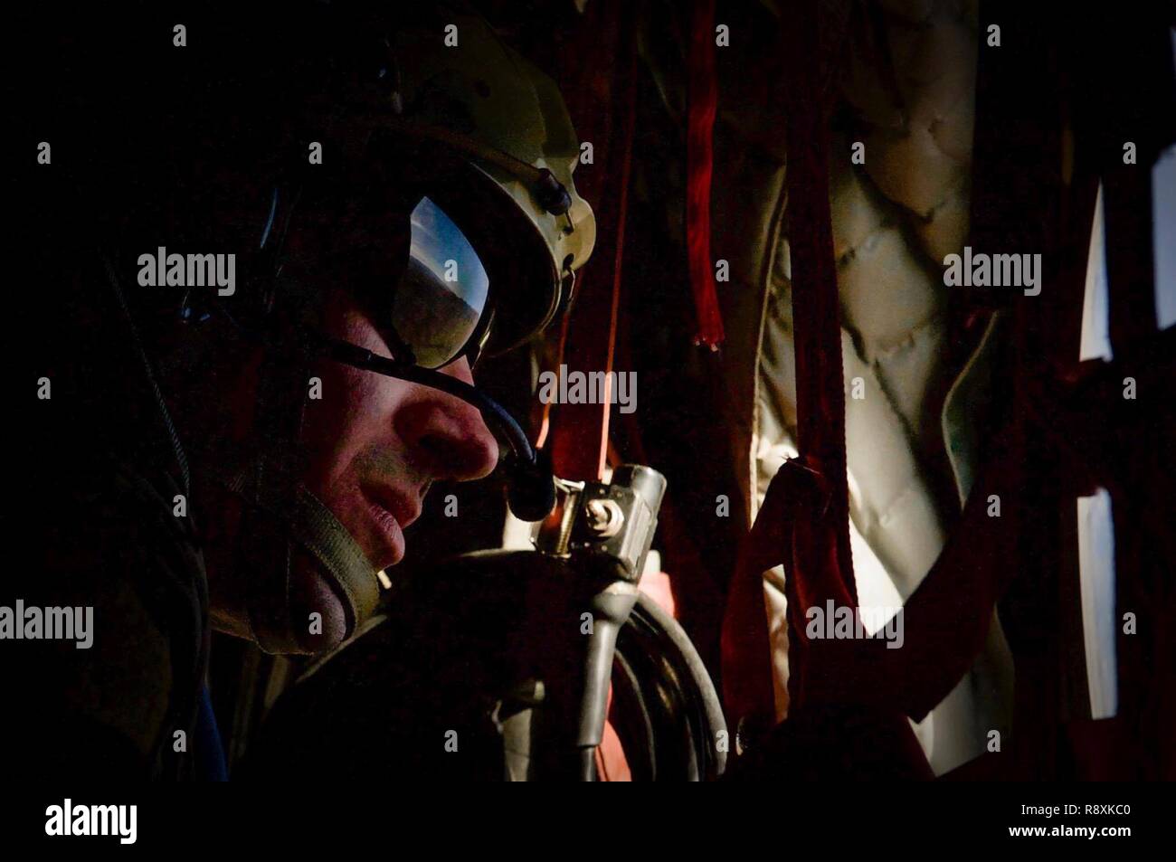 A Survival, Evasion, Resistance, and Escape specialist looks out the ...