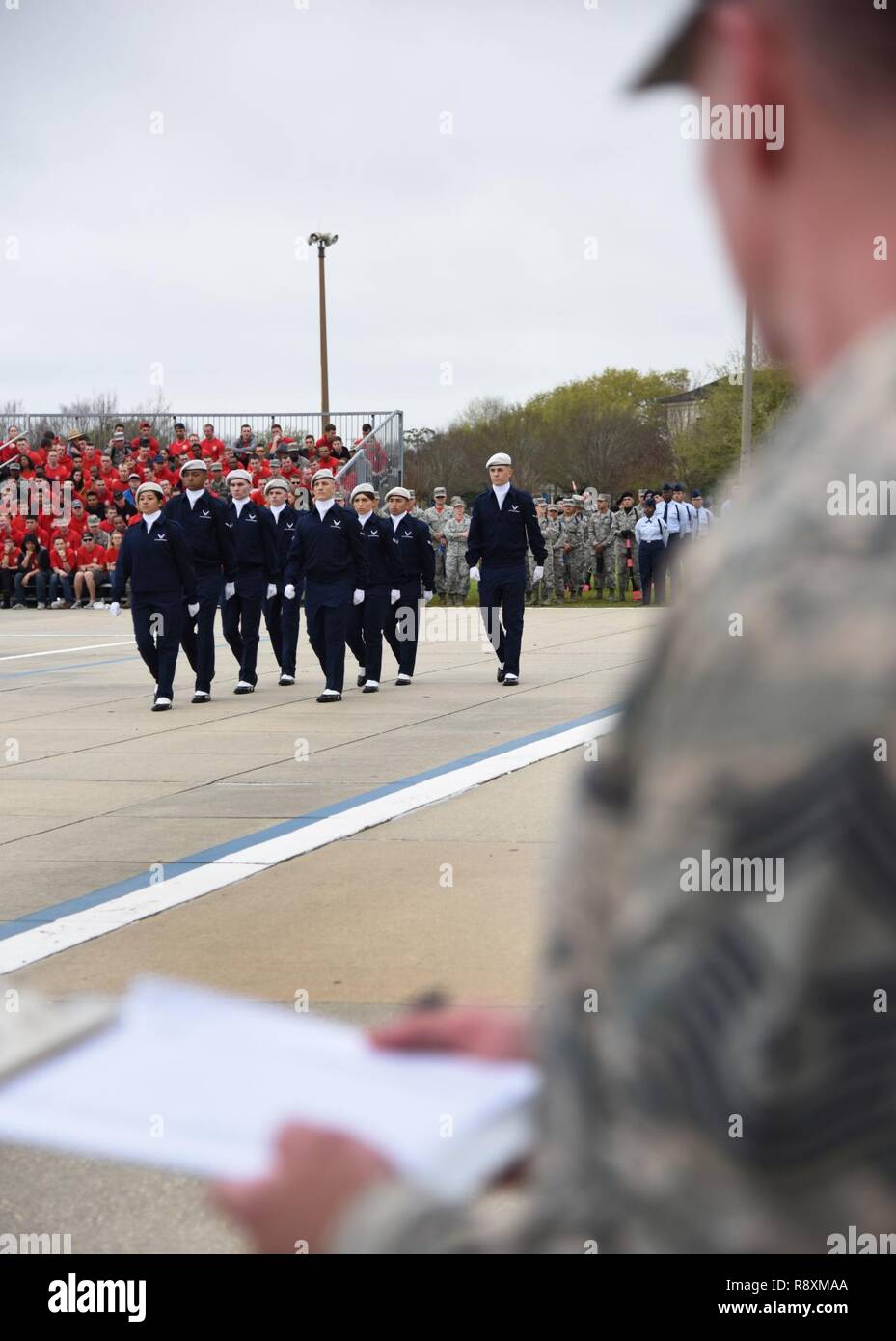 Members of the 334th Training Squadron regulation drill team perform during the 81st Training Group drill down at the Levitow Training Support Facility drill pad March 10, 2017, on Keesler Air Force Base, Miss. Airmen from the 81st Training Group competed in a quarterly open ranks inspection, regulation drill routine and freestyle drill routine with the 334th TRS “Gators” taking first place. Stock Photo