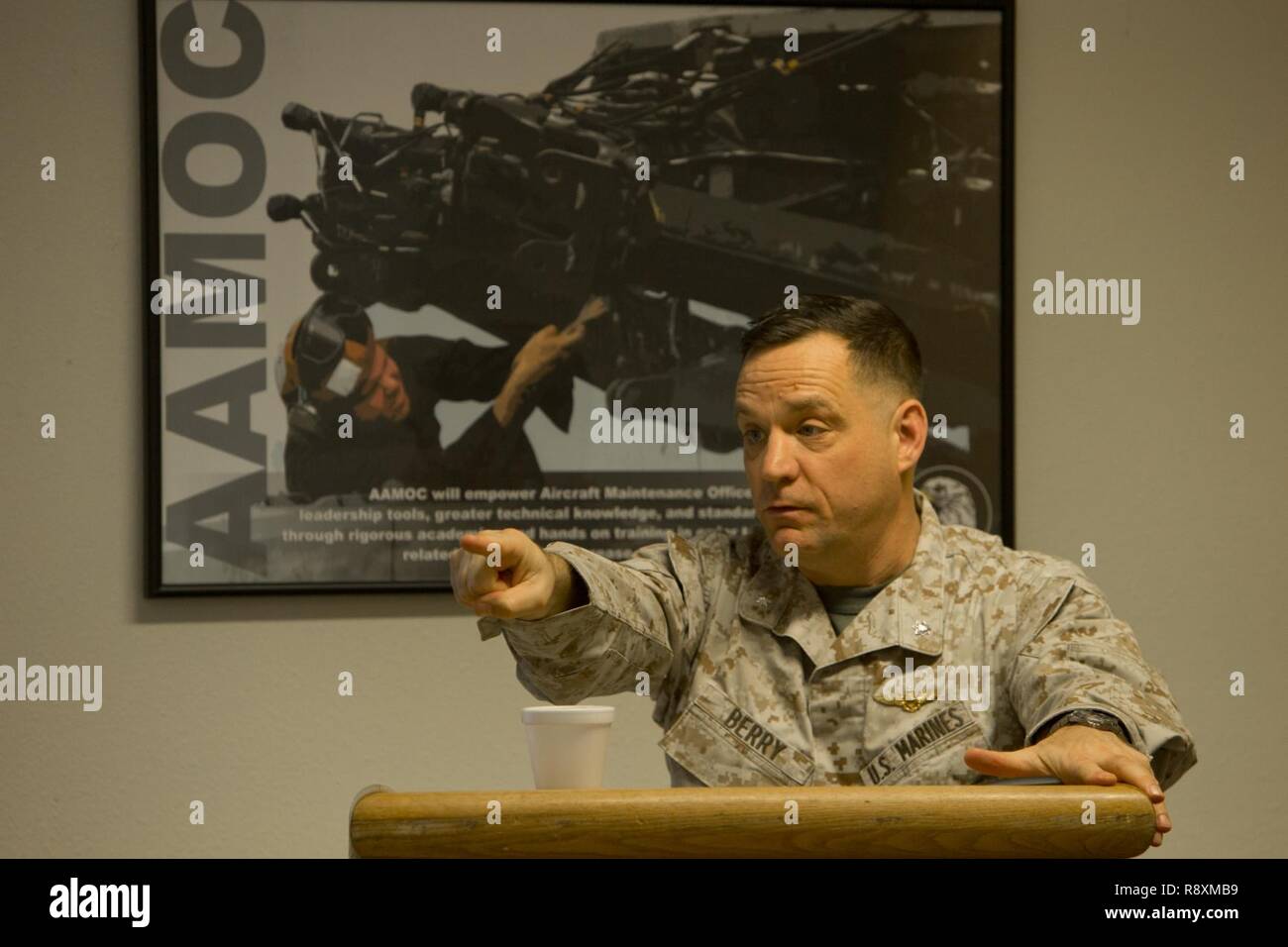 U.S. Marine Corps LtCol. Guy G. Berry, strategy and plans with Headquarters Marine (HQMC) gives a period of instruction about the Aircraft Maintenance Officer Course (AAMOC) at Marine Corps Air Station Yuma, Ariz., on Mar. 14, 2017. AAMOC will empower Aircraft Maintenance Officers with leadership tools, greater technical knowledge, and standardized practices through rigorous academics and hands on training in order to decrease ground related mishaps and increase sortie generation. Stock Photo
