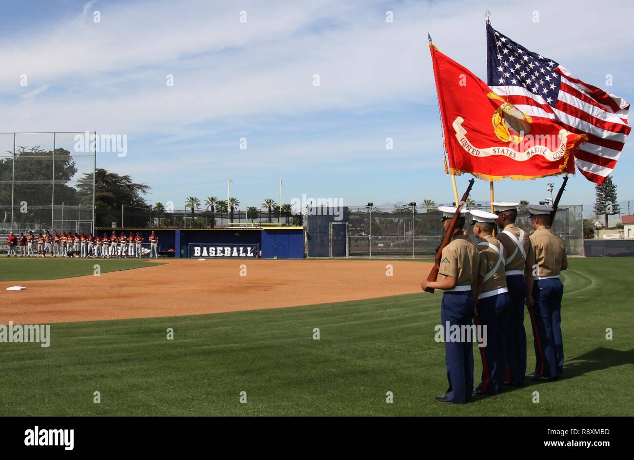 Marine Corps Recruiters of Substation Lakewood present colors during a varsity baseball game at St. John Bosco High School, Bellflower, Calif., March 14, 2017. Stock Photo