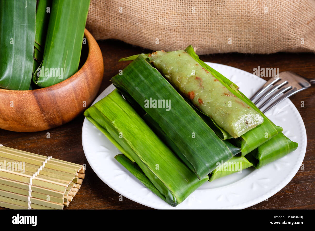 Suman pinipig with buko latik as filipino dessert Stock Photo