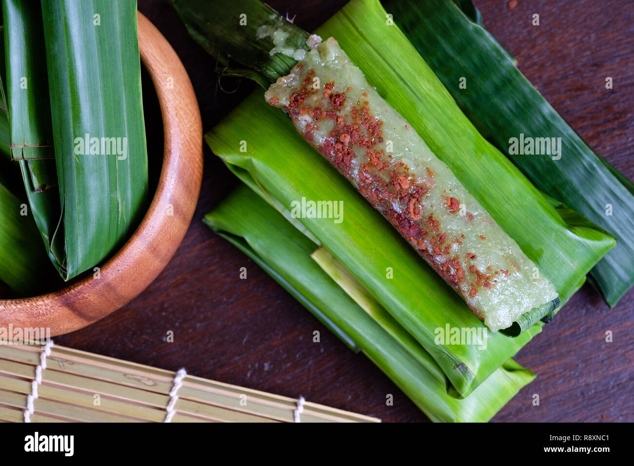 Suman pinipig with buko latik as filipino dessert Stock Photo