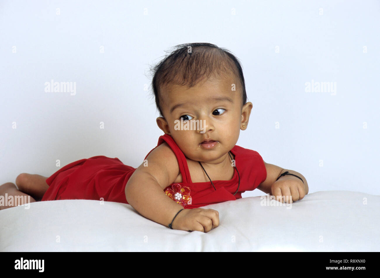 small baby laying, India, MR. NO. 364 Stock Photo