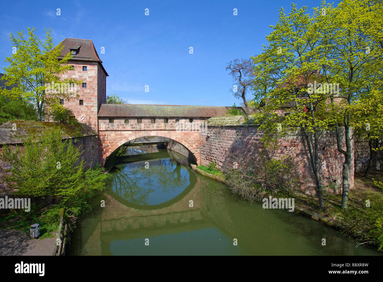 Old city wall with bridge bow, tower, mirroring in Pegnitz river, old district, old town, Nuremberg, Franconia, Bavaria, Germany, Europe Stock Photo