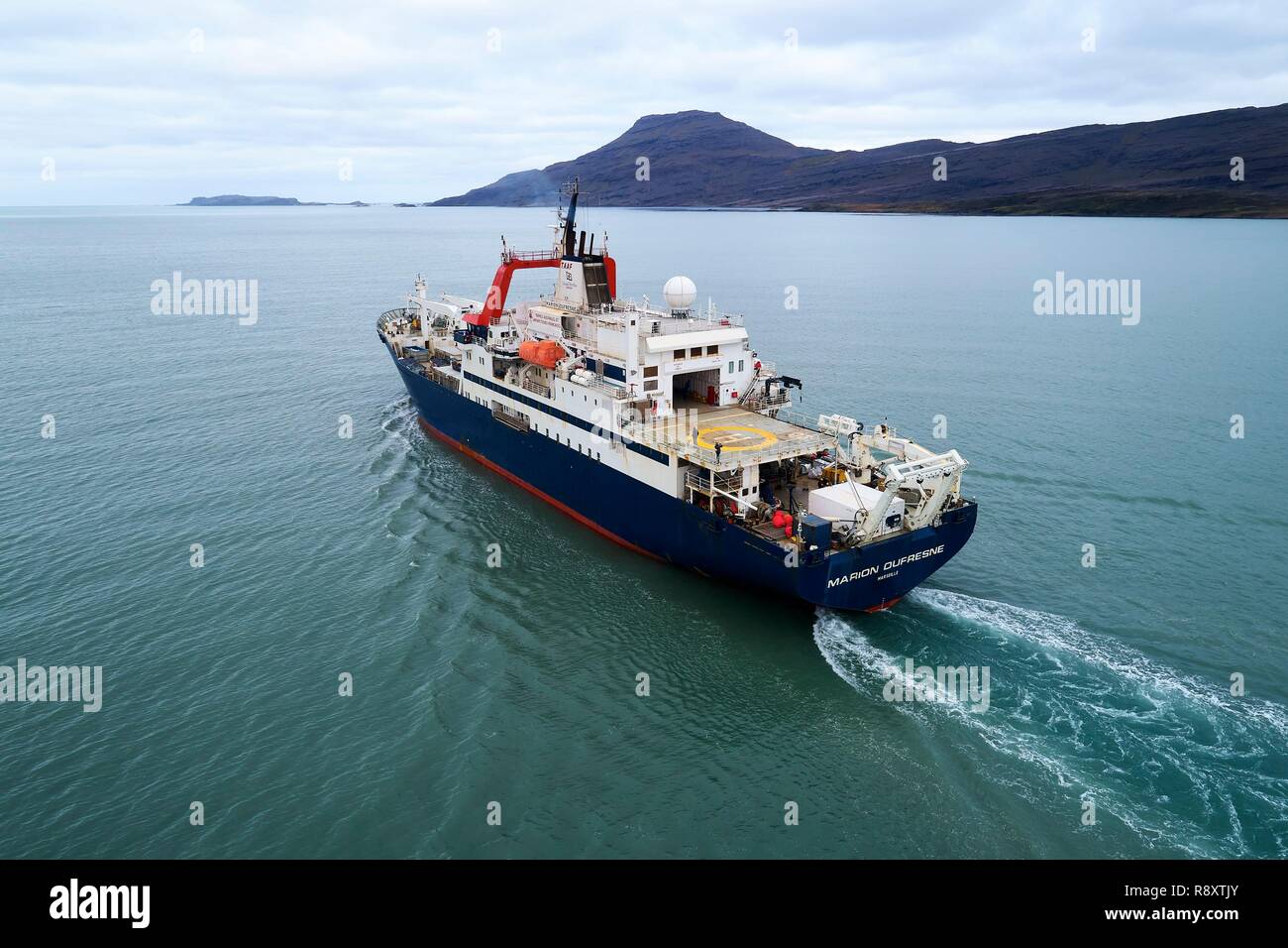 France, Indian Ocean, French Southern and Antarctic Lands, Kerguelen Islands, Rallier du Baty Peninsula, Baie de la Table, the Marion Dufresne (supply ship of French Southern and Antarctic Territories) (aerial view) Stock Photo