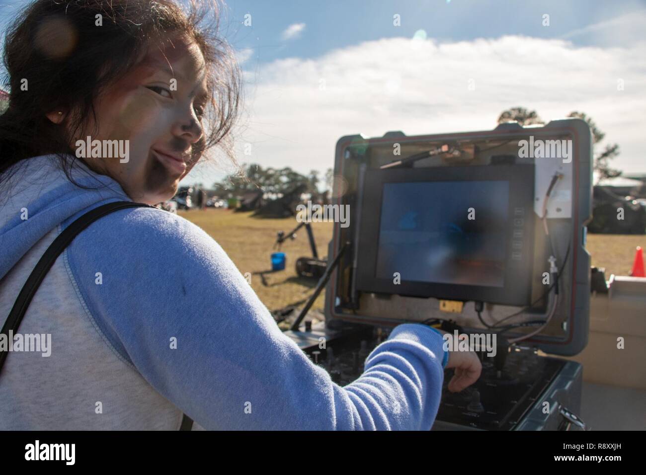 Jennifer Solorzano operates the “Foster-Miller Talon”, a remotely operated tracked vehicle designed to remove explosives from the battlefield, at the Family Day event during Marne Week at Fort Stewart, Ga., Dec. 6, 2018. Every year, 3rd ID celebrates Marne Week in order to recognize the achievements of the Dogface leaders, Soldiers and Families. This year, the Marne Division celebrated the 100th anniversary of the Battle of the Marne-the historic World War 1 battle where the division adopted their moniker of the “The Rock of the Marne.’ Stock Photo