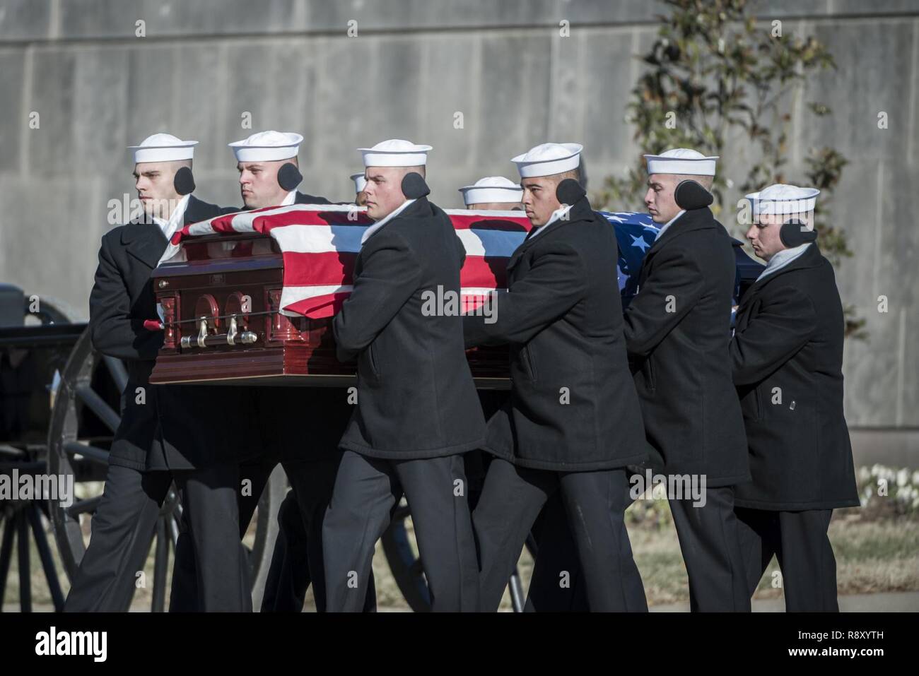 Sailors from the U.S. Navy Ceremonial Guard folds the U.S. flag as part of the military funeral honors with funeral escort for U.S. Navy Seaman 1st Class William Bruesewitz in Section 60 of Arlington National Cemetery, Arlington, Virginia, Dec. 7, 2018. On Dec. 7, 1941, Bruesewitz was assigned to the battleship USS Oklahoma which was moored at Ford Island, Pearl Harbor when the ship was attacked by Japanese aircraft. After sustaining multiple torpedo hits, the USS Oklahoma quickly capsized and resulted in the deaths of 429 crewmen, including Bruesewitz.    From the Defense POW/MIA Accounting A Stock Photo
