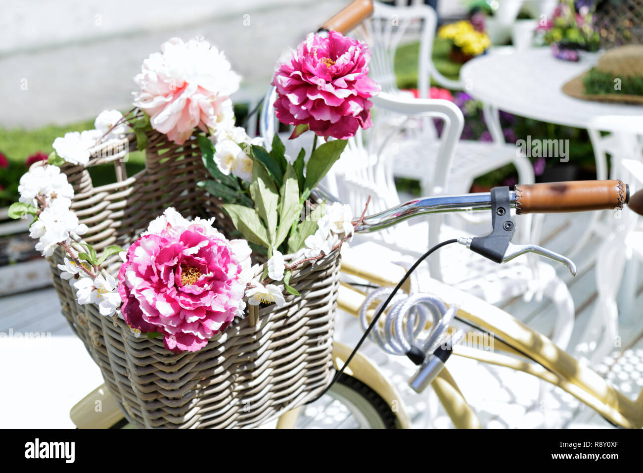Bicycle basket decorated with flowers Stock Photo Alamy