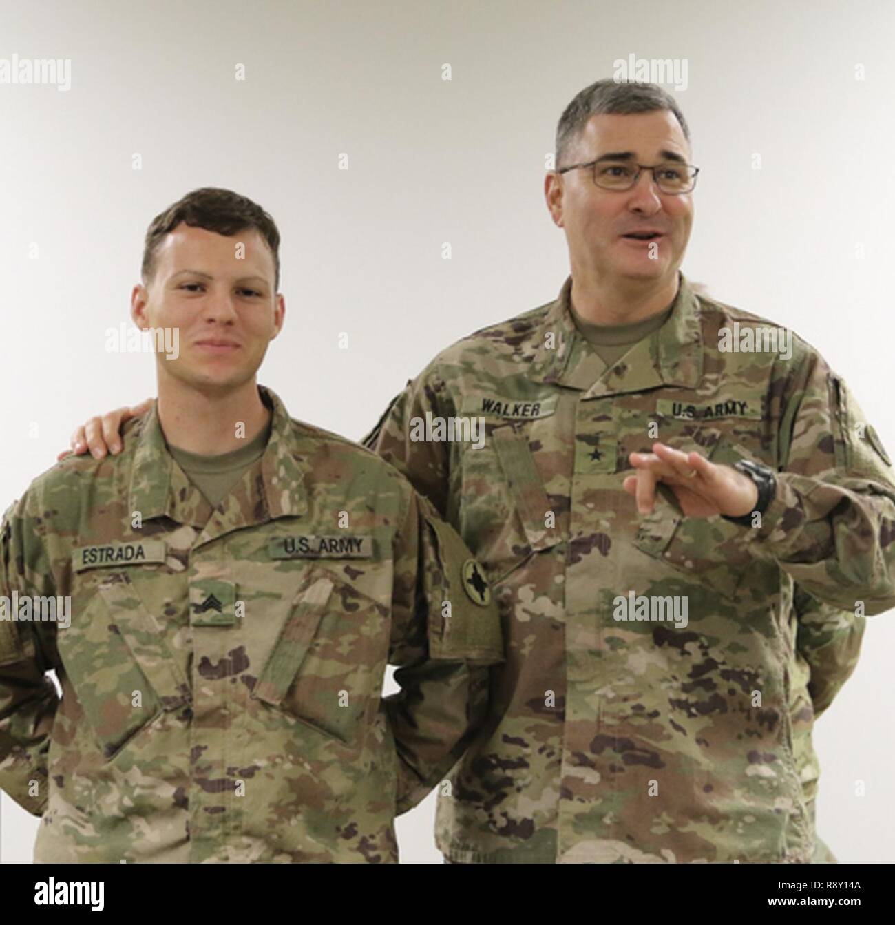 Newly promoted Sgt. Casiano Estrada, 184th Sustainment Command, stands with Brig. Gen. Clint E. Walker, 184th SC commander. Mentorship is an important key to the success of future leaders of the Army. Stock Photo