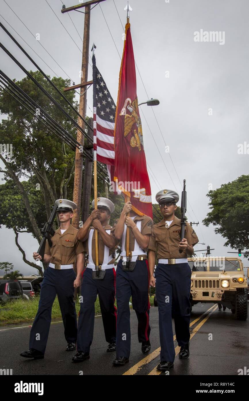 U.S. Marines with the Marine Aircraft Group 24 march during