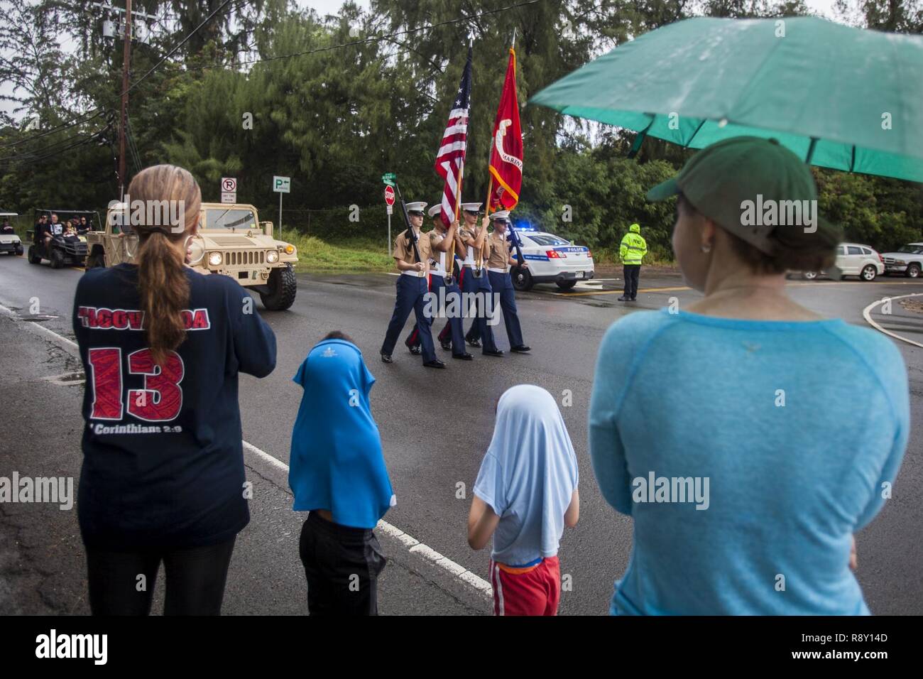 A crowd watches U.S. Marines with Marine Aircraft Group 24