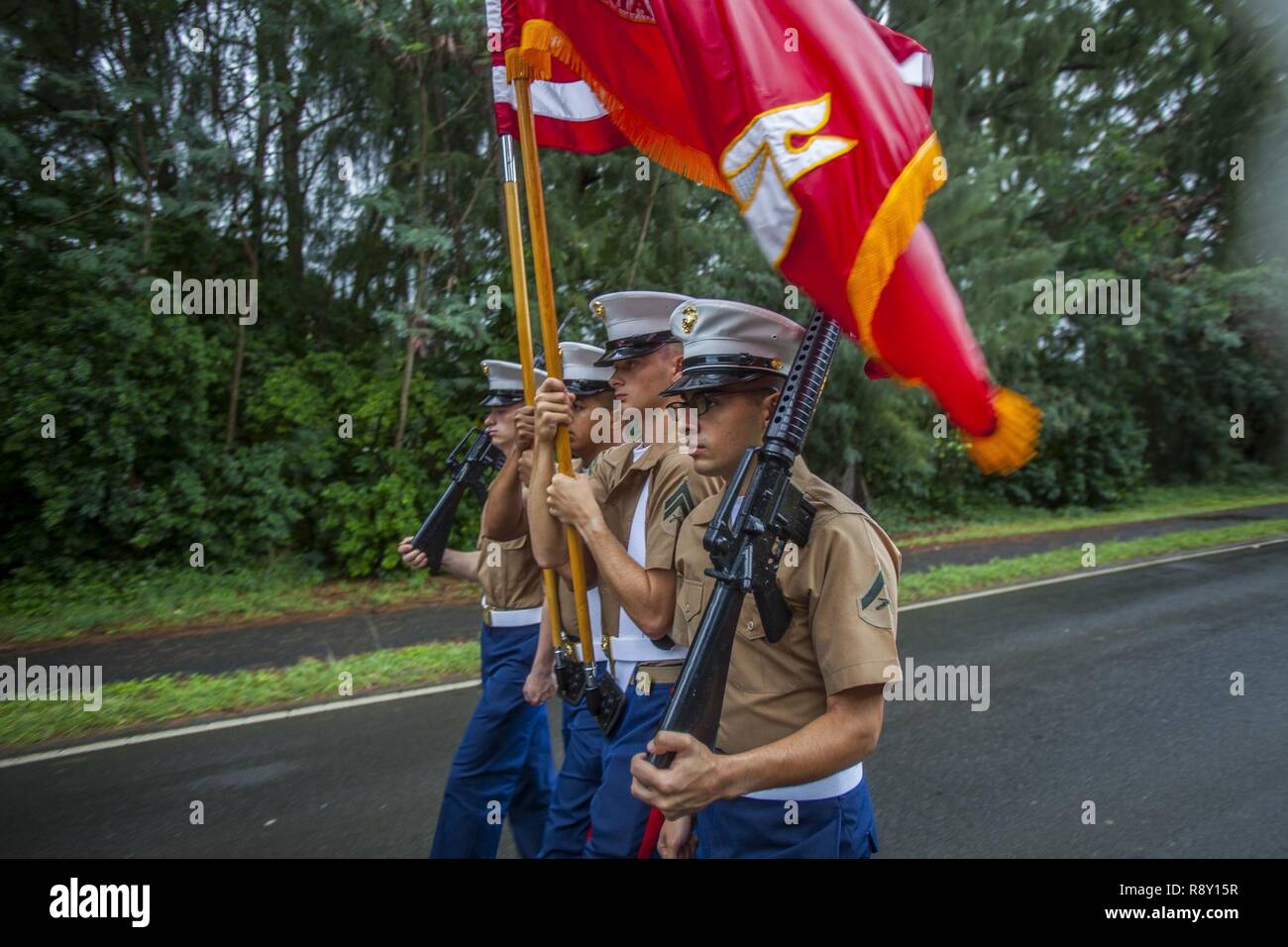 U.S. Marines with the Marine Aircraft Group 24 march during