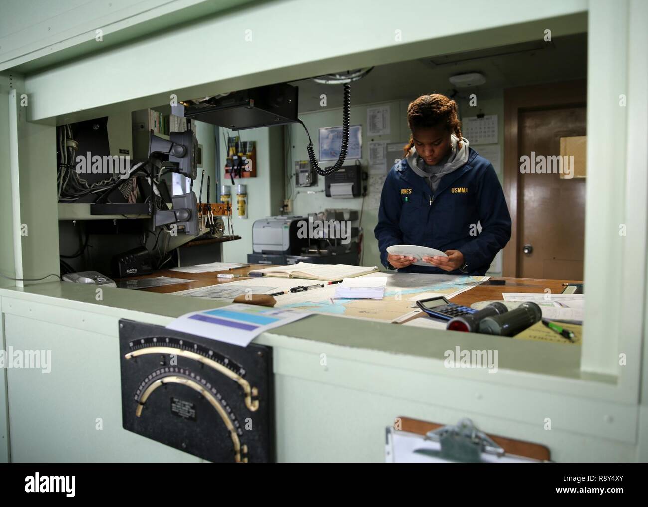 ATLANTIC OCEAN (February 21, 2017)--Deck Cadet Victoria Jones, a midshipment at the United States Merchant Marine Academy, makes calculations with wind wheel from the bridge of Military Sealift Command's hospital ship USNS Comfort (T-AH 20), Feb. 21. Six midshipment are currently attached to Comfort as part of their 'Sea Year' which is designed to provide cadets with practical training. Stock Photo