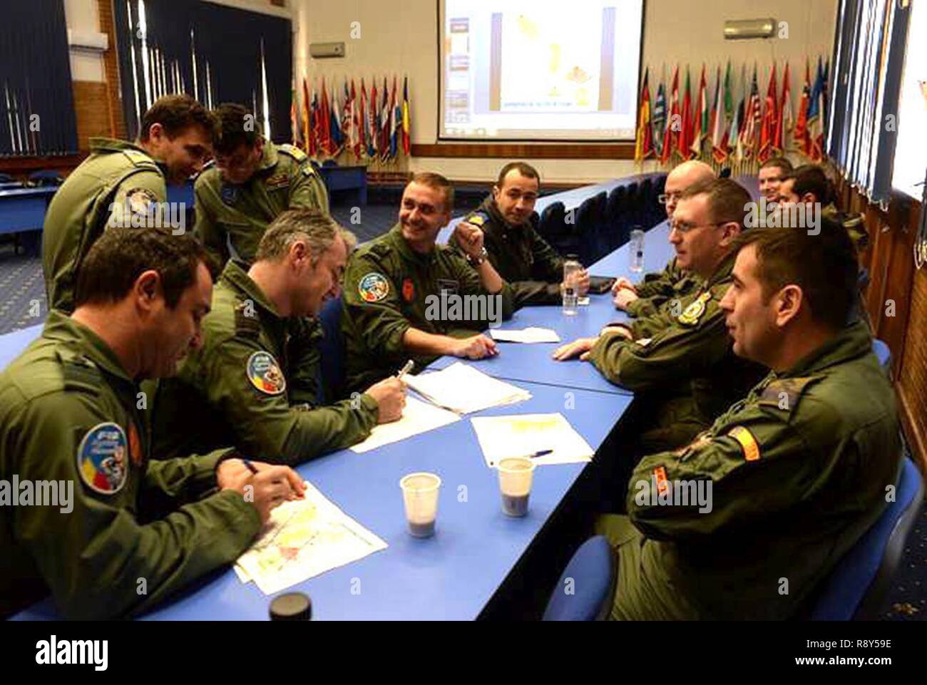 Aircrew from the U.S. Air Force and the Romanian air force discuss ...