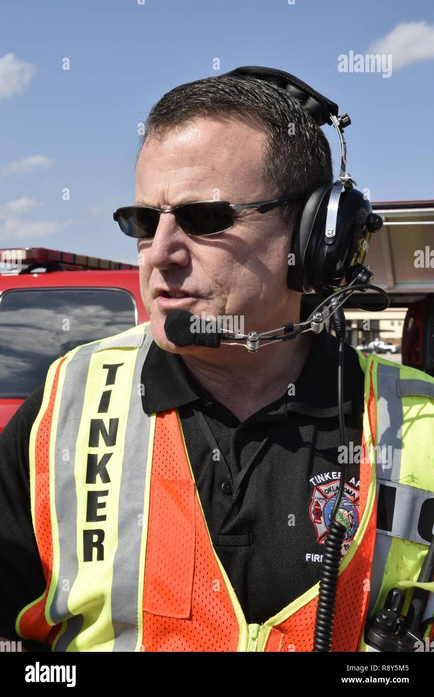 Terry Ford, 72nd Civil Engineer incident commander, talks in to a radio