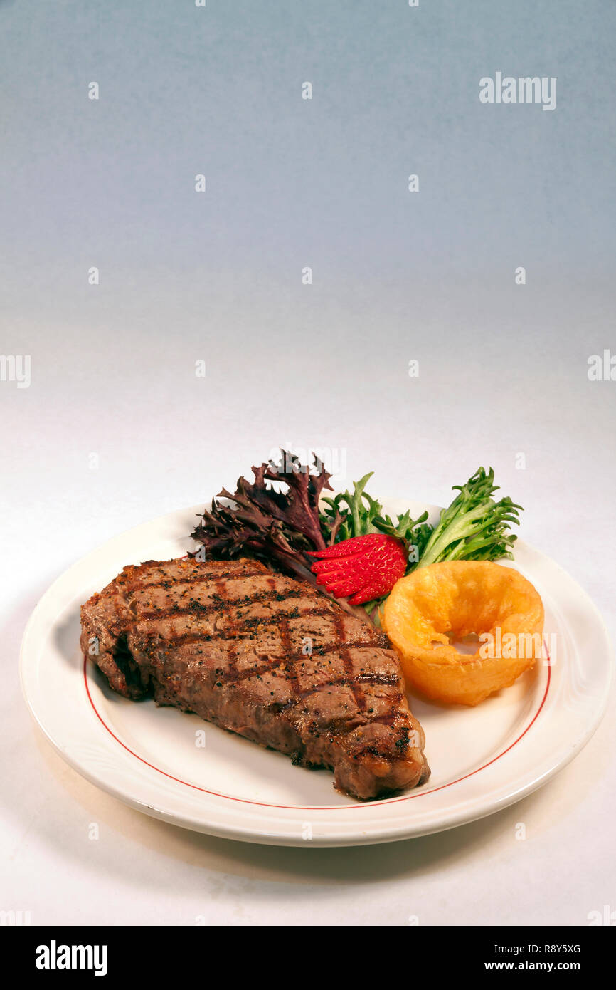 New York Strip Steak dinner with vegetables, by James D Coppinger