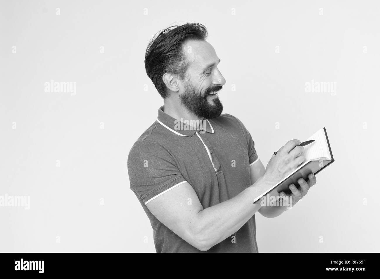 Time management skills. Man planning schedule hold notepad. Man bearded manager happy smiling face. Successful man planning schedule meeting copy space. Change your life tracking useful habits. Stock Photo