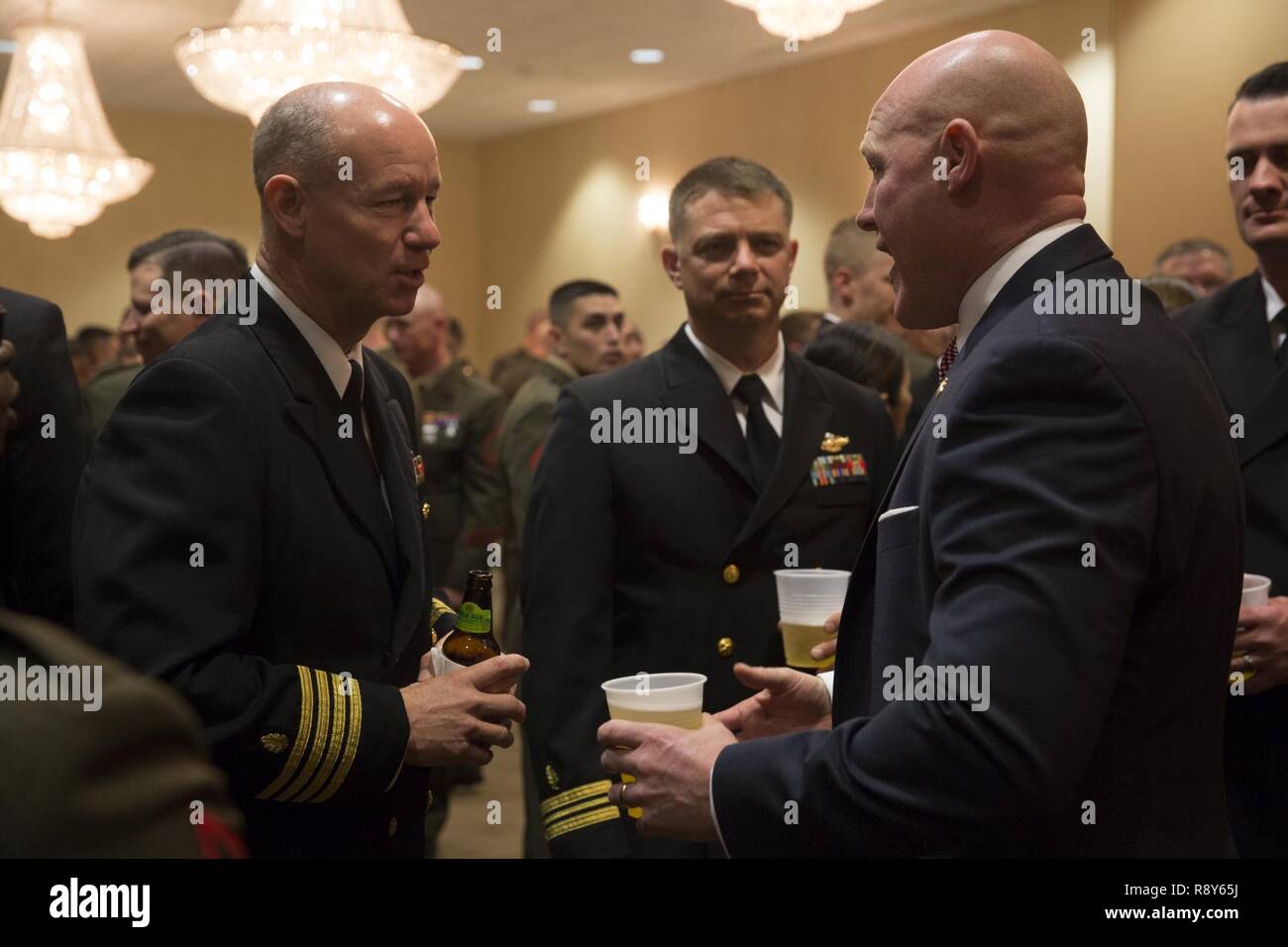 Sgt. Maj. Micheal Barrett (ret.), right, speaks to Marines and Sailors with 1st Marine Logistics Group during the 1st MLG Officer and Staff Noncommissioned Officer Mess Night at Camp Pendleton, Calif., March 3, 2017. Barrett, the 17th Sergeant Major of the Marine Corps, was the honored guest at the mess night, an event designed to foster camaraderie and esprit de corps. Stock Photo