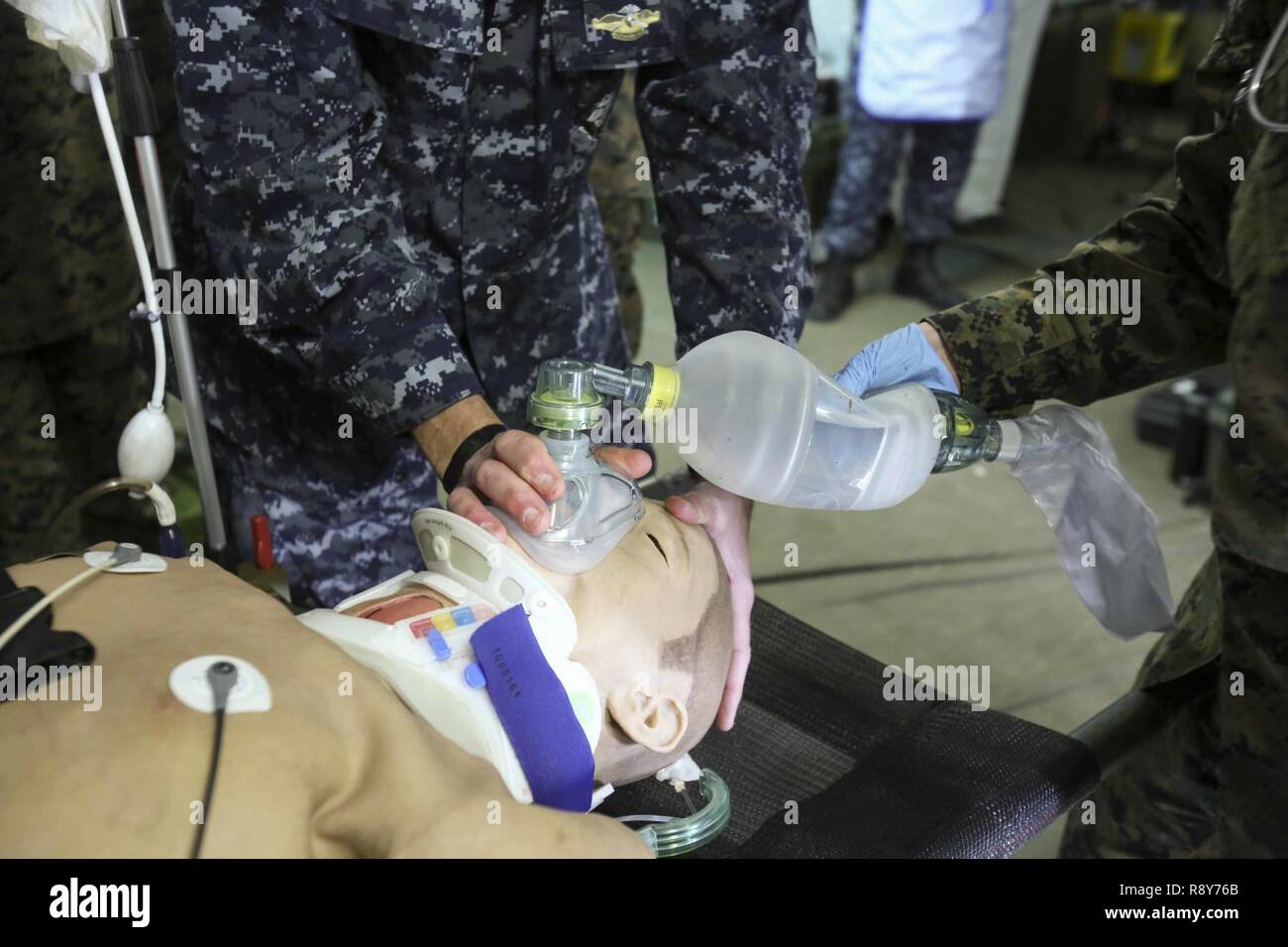 Sailors provide oxygen to a notional patient during Naval Medical Augmentation Program training at Camp Lejeune, N.C., Feb. 27-March 2. The training is designed for Sailors to ensure they maintain their skill sets to save service members’ lives in a deployed setting. The Sailors are with 2nd Medical Battalion. Stock Photo