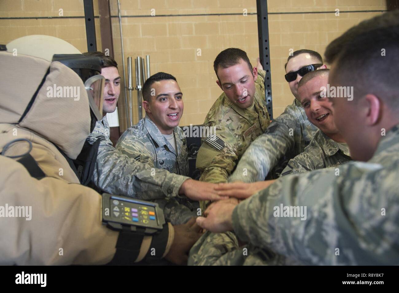 Airmen from the 23d Civil Engineer Squadron explosive ordnance disposal section make Malcolm Mitchell, New England Patriots’ wide receiver and Super Bowl LI Champion an honorary EOD Airman during a visit March 7, 2017, at Moody Air Force Base, Ga. Mitchell, who is a Valdosta native, got a glimpse of a typical day in the life of some of Moody’s Airmen from the 23d Fighter Group, 23d Maintenance Group, 23d Mission Support Group, and the 820th Base Defense Group. During his visit, Mitchell also spent time with Airmen and signed autographs for local Patriots fans. Stock Photo