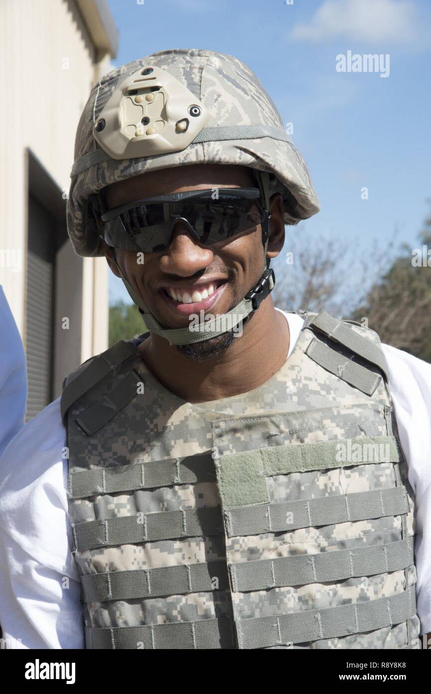 Malcolm Mitchell, New England Patriots’ wide receiver and Super Bowl LI Champion, poses for a photo prior to a rollover demonstration in the Mine-Resistant Ambush-Protected Egress Trainer during a visit March 7, 2017, at Moody Air Force Base, Ga. Mitchell, a Valdosta native, got a glimpse of a typical day in the life of Moody Airmen. Mitchell also spent time with Airmen and signed autographs for local Patriots’ fans during his visit. Stock Photo