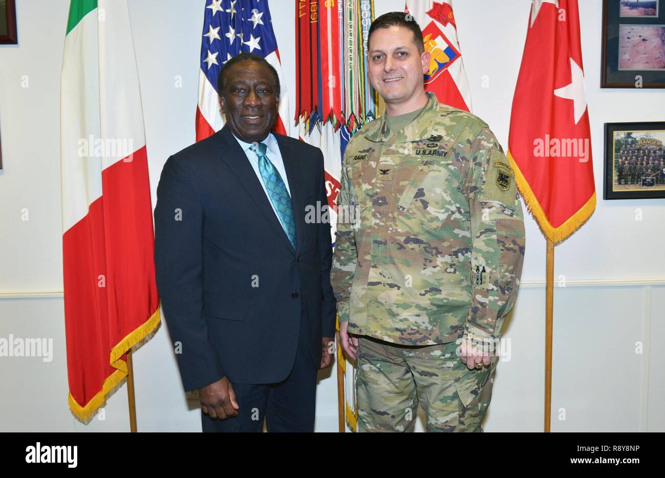 Col. Louis B. Rago (right), chief of staff for U.S. Army Africa, and Mr. Ray B. Shepherd, Director Defense Media Activity; pose for a photograph in the USARAF commander's office during a recent visit to Caserma Ederle, Vicenza, Italy Mar. 9, 2017. Stock Photo