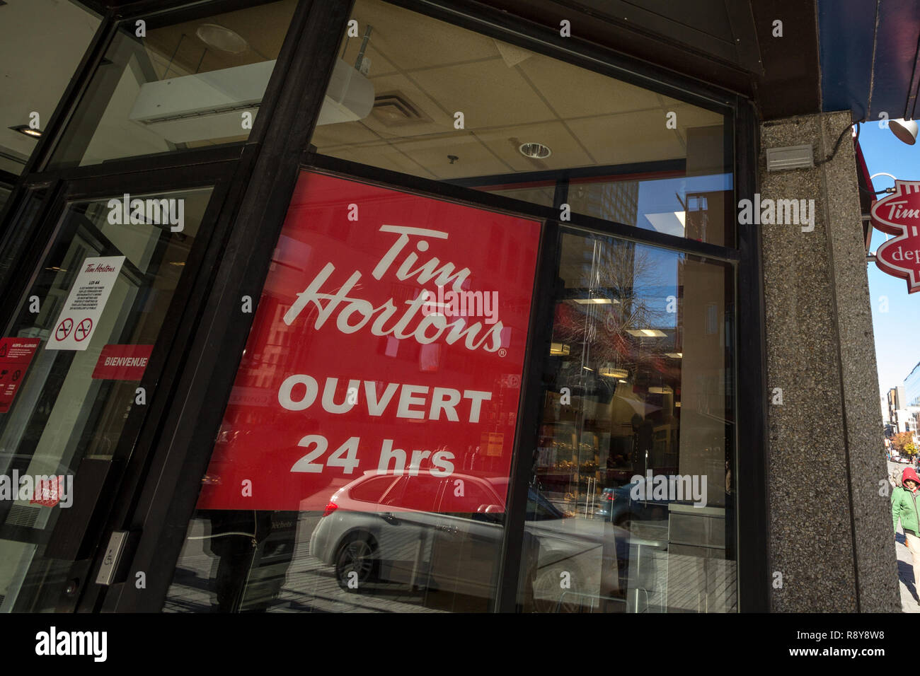 MONTREAL, CANADA - NOVEMBER 4, 2018: Tim Hortons logo in front of one of their restaurants in Montreal, Quebec. Tim Hortons is a cafe and fastfood can Stock Photo