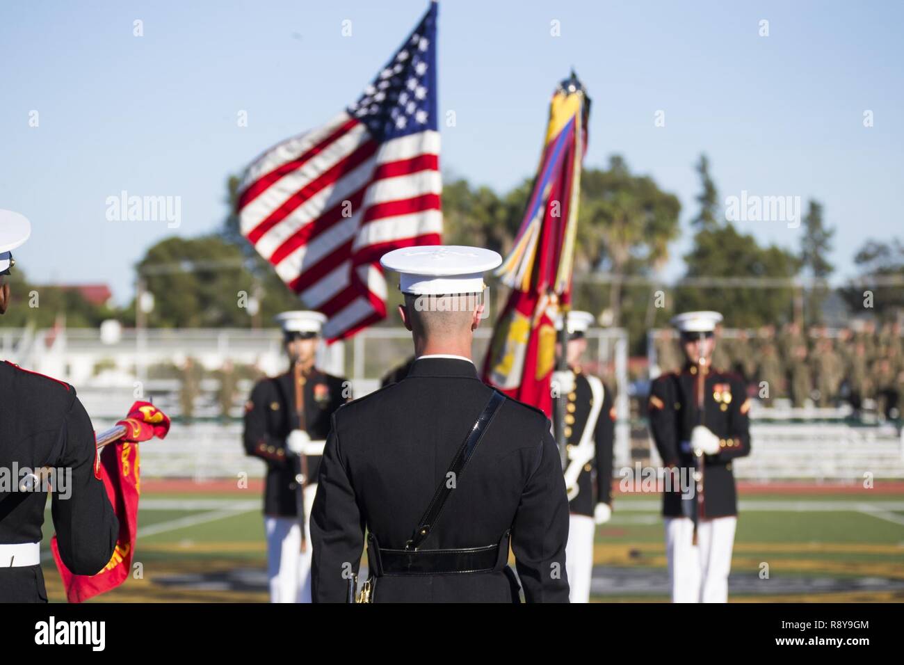 U.S. Marines with the Official Color Guard of the Marine Corps, Battle Color Detachment, Marine Barracks Washington, D.C., perform during the Battle Color Ceremony at the 11 Area football field on Camp Pendleton, Calif., March 9, 2017. The ceremony featured “The Commandant’s Own," the United States Marine Drum & Bugle Corps, the Silent Drill Platoon, and the Official Color Guard of the Marine Corps. Stock Photo