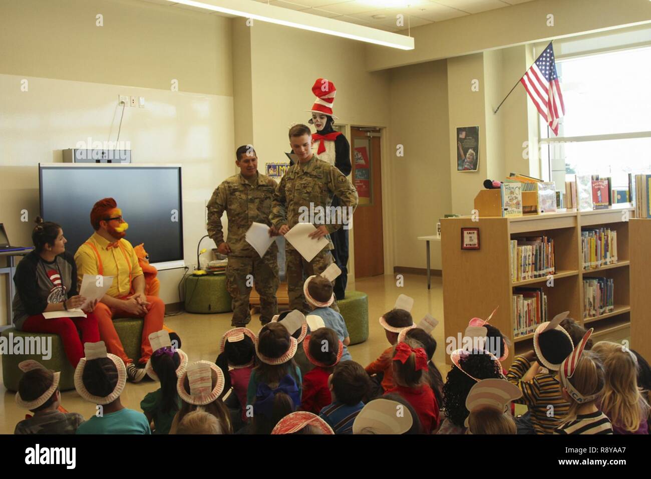 Two Soldiers from the 716th Military Police Battalion, 101st Airborne Division (Air Assault) Sustainment Brigade, 101st Abn. Div., participate in a rehearsal of “The Cat in the Hat” production staff members of Marshall Elementary School put together for the students, March 2, 2017, at Marshall Elementary School on Fort Campbell, Kentucky. The school celebrated the 20th Anniversary of Read Across America by inviting soldiers from 716th MP Bn. To the school and putting the production for the students to encourage and promote reading. Stock Photo