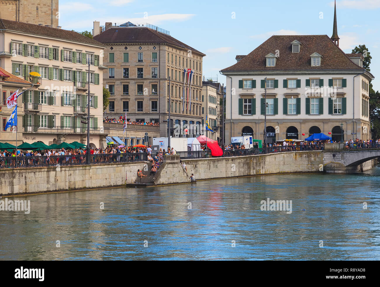 Zurich, Switzerland - August 2, 2014: embankment of the Limmat river during the Street Parade. The Street Parade is the most attended technoparade in  Stock Photo