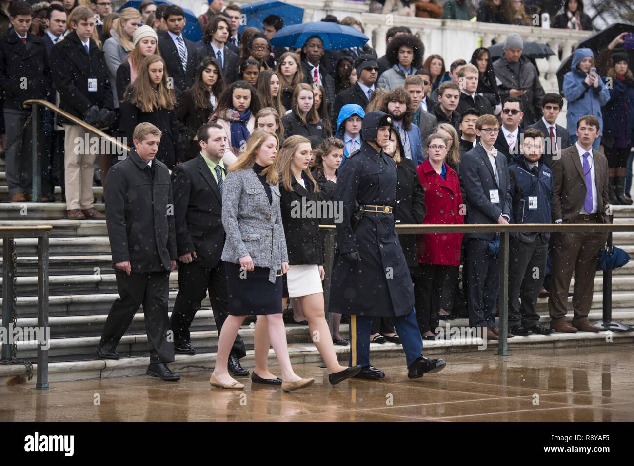 From the left, Andrew Pogue, from Missouri; Dakota Fleury, from Washington, D.C.; Marion Lovett, from New Hampshire; and Amanda Finnegan, from South Dakota; represent the high school students participating in the United States Senate Youth Program during a wreath laying ceremony at the Tomb of the Unknown Soldier in Arlington National Cemetery, March 10, 2017, in Arlington, Va. The students also toured the Memorial Amphitheater Display Room. Stock Photo