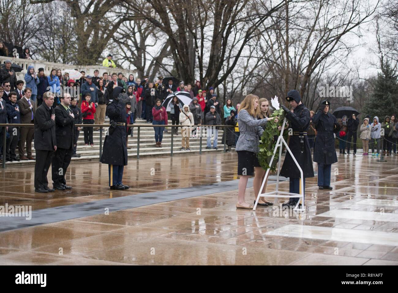 From the left, Andrew Pogue, from Missouri; Dakota Fleury, from Washington, D.C.; Marion Lovett, from New Hampshire; and Amanda Finnegan, from South Dakota; represent the high school students participating in the United States Senate Youth Program during a wreath laying ceremony at the Tomb of the Unknown Soldier in Arlington National Cemetery, March 10, 2017, in Arlington, Va. The students also toured the Memorial Amphitheater Display Room. Stock Photo