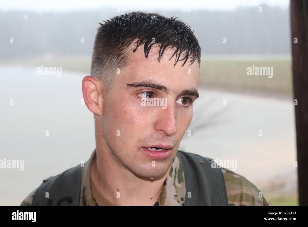 Sgt. Austin Eubanks, 287th Engineer Company based in Lucedale, Miss., recovers after conducting a land navigation course in a torrential downpour during the Mississippi National Guard’s 2017 Best Warrior Competition at Camp McCain near Elliott, Miss., March 7, 2017. (Mississippi National Guard Stock Photo