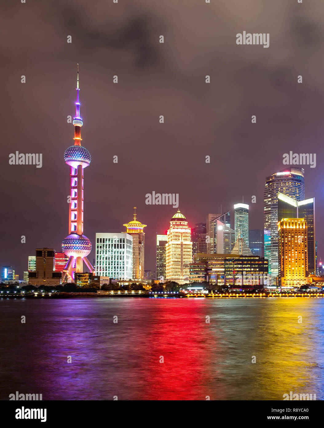 Illuminated Shanghai city skyline with colorful lights on water surface Stock Photo - Alamy