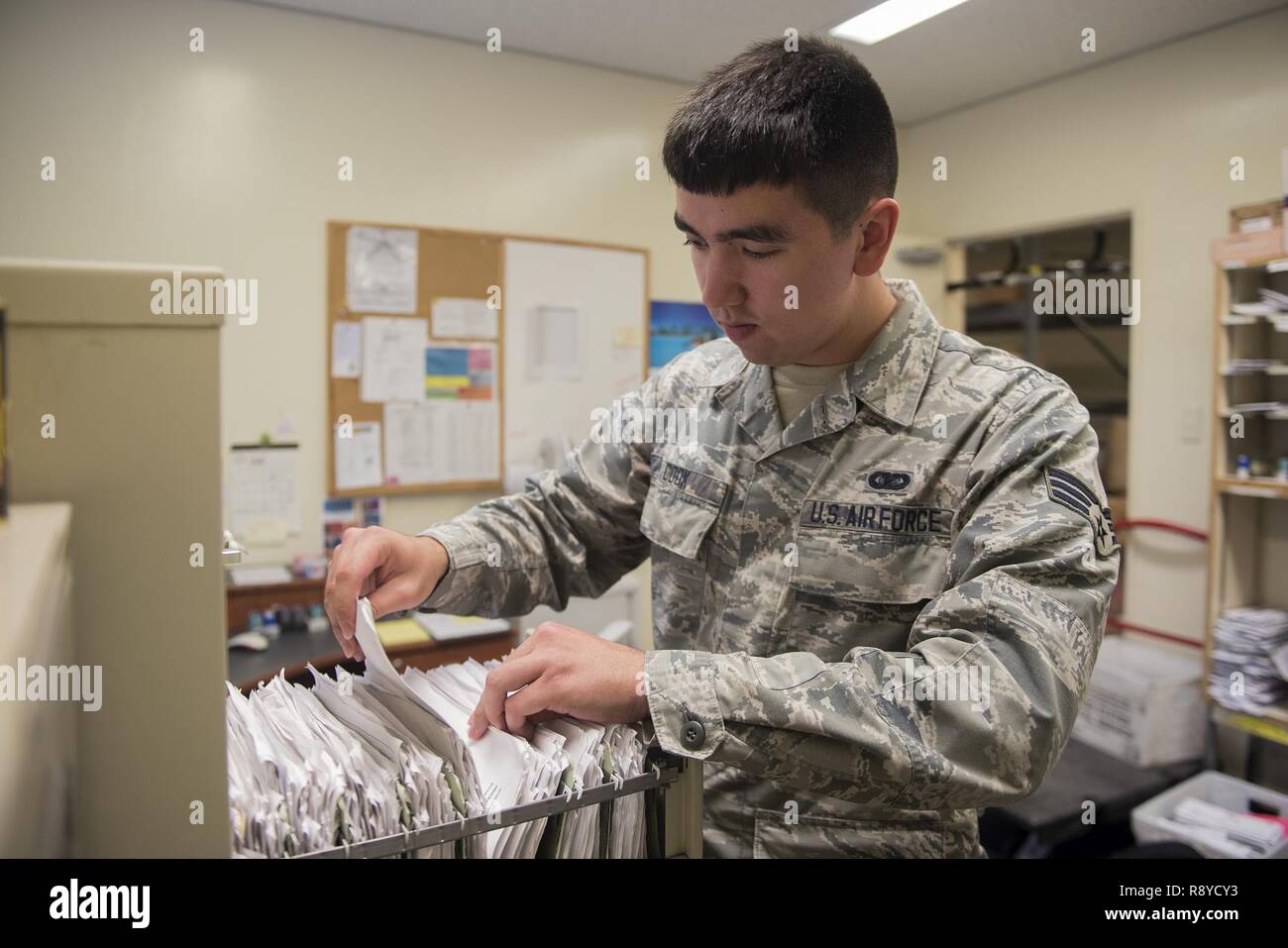 u-s-air-force-senior-airman-calvin-cook-18th-communications-squadron-postal-clerk-files-member-s-p-o-box-information-at-the-kadena-air-base-post-office-march-13-2017-on-kadena-air-base-japan