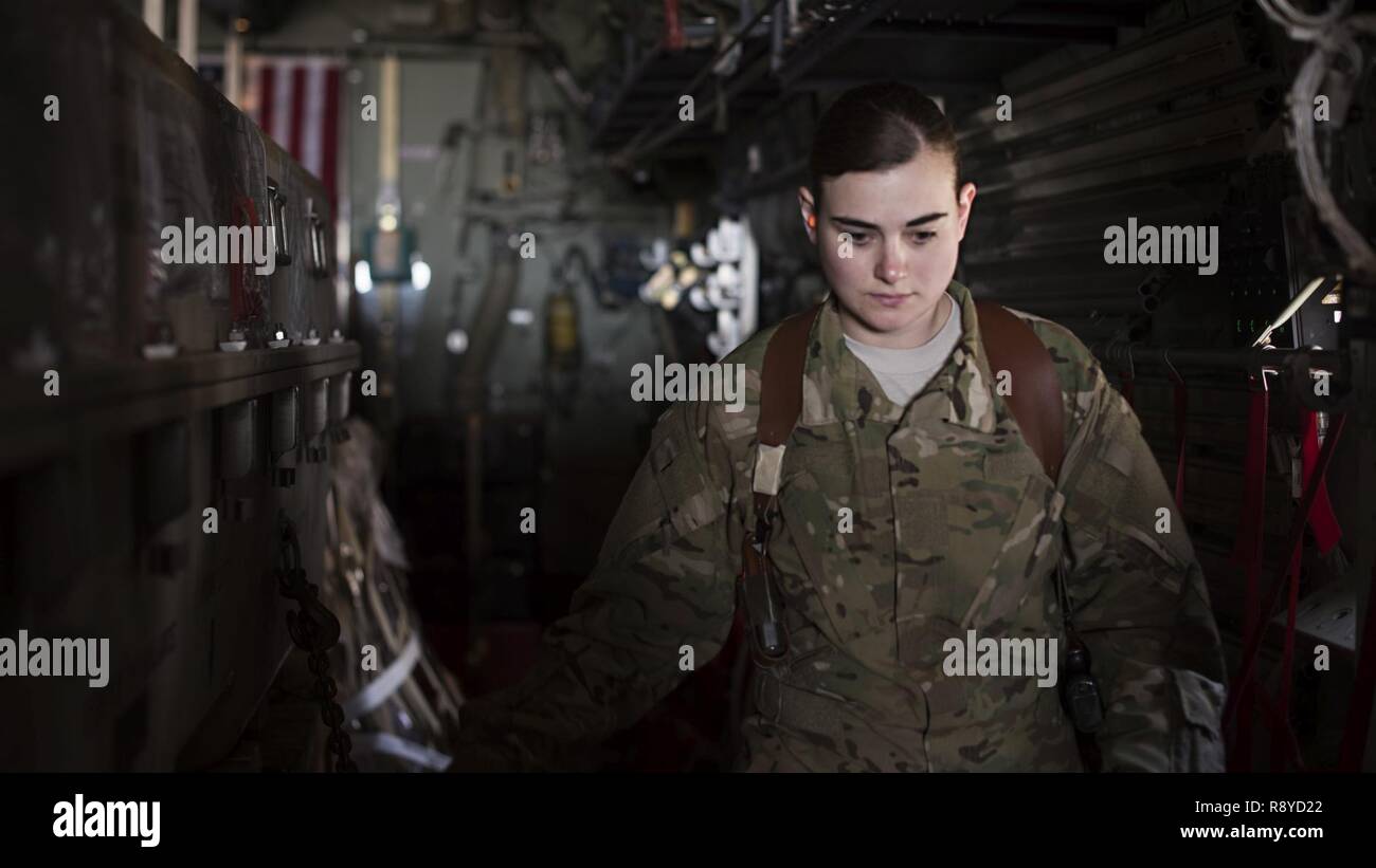 Senior Airman Samantha Masten, 774th Expeditionary Airlift Squadron C-130J Hercules loadmaster, inspects cargo March 8, 2017 at Bagram Airfield, Afghanistan. Masten is a member of a 4-person crew belonging to the 774th EAS that provides tactical airlift throughout the Afghan theater. Stock Photo