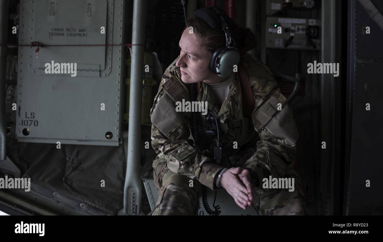 Senior Airman Dallas Pope, 774th Expeditionary Airlift Squadron C-130J Hercules loadmaster, waits for a fuel truck March 8, 2017 at Bagram Airfield, Afghanistan. Pope flies throughout the Afghan theater with the same crew three to four times per week, sometimes for twelve hours or more each day. Stock Photo