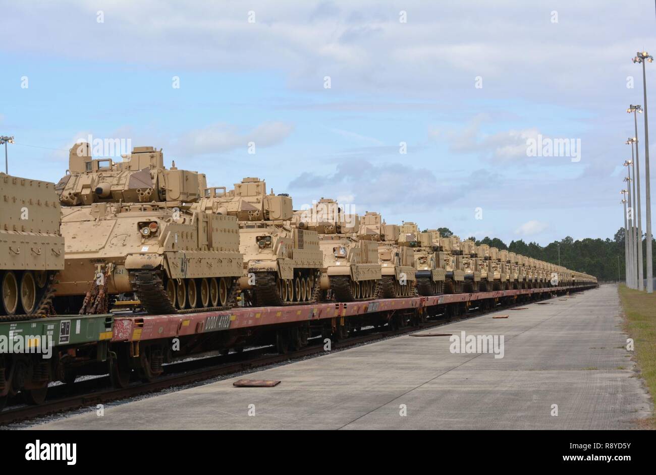 Bradley Fighting Vehicles from 1st Armored Brigade Combat Team, 3rd Infantry Division are loaded